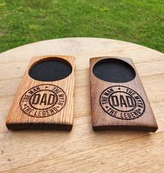 two wooden bottle openers sitting on top of a table