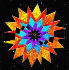 a colorful star in the middle of a black background