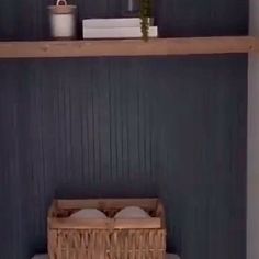 a shelf with two baskets on top of it