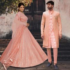 Menswear:- Faux Georgette Sherwani in Peach. This Readymade attire with Satin Lining is Enhanced With Fancy Buttons, Pockets, Stone Studded Brooch, Resham and Sequins Work. Crafted in Chinese Collar Neck and Full Sleeve Available with an Art Silk Pant in Peach and an Art Silk Inner Front Open Kurta in Peach Do note: Footwear shown in the image is for presentation purposes only. Half to one inch may vary in measurement. (Slight variation in actual color vs. image is possible) Lehenga Choli:- Faux Bandhgala With Resham Embroidery For Reception Navratri, Resham Embroidered Bandhgala For Reception Navratri, Embroidered Bandhgala For Navratri Reception, Embroidered Bandhgala For Reception And Navratri, Festive Pink Sherwani With Dabka Work, Reception Sherwani With Chikankari Embroidery For Navratri, Pink Bandhgala With Dabka Work For Reception, Pink Sherwani With Dabka Work, Fitted Pink Sherwani With Dabka Work