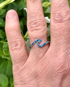 Sterling Silver Wave Ring with Blue Lab Opal | The Life Divine Keep the ocean close and go with the flow. This sterling silver Wave Ring symbolizes the ups and downs we see in life, reminding you to roll with the tides. Wear this ring as a reminder to stay positive, happy and strong regardless of what life throws your way.Cherished for its brilliance, Opal is known as a stone of creativity and vitality. Opal is also a reflective stone of protection, absorbing energies and sending them back to th Ocean-inspired Blue Ring For Gift, Ocean-inspired Blue Ring For Gifts, Ocean-inspired Blue Rings As Gifts, Wave Ring, Go With The Flow, Stay Positive, What Is Life About, 4 H, Ring Designs