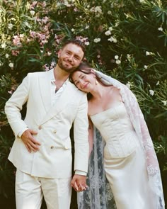 a bride and groom posing for a photo