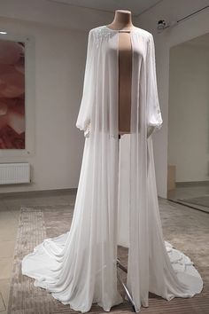 a white dress on display in a room