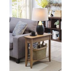 a living room scene with focus on the end table and lamp in the foreground