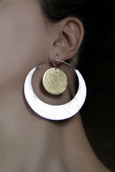 Sun and moon clip on earrings. Lovely inspirational jewelry in silver and gold. Metallic color dangle and drop earrings. Big, statement jewelry - a nice gift for her. Handcrafted with LOVE! Size: 2.9 inch x 2.7 inch 7.4 cm x 6.8 cm They can be made in the following color combinations: 1) Gold sun + Silver moon (crescent) as pictured 2) Gold moon (crescent) + Silver sun 3) Gold moon (crescent) + Copper sun 4) Copper sun + Silver moon (crescent) 5) Copper moon (crescent) + Silver sun 6) Copper moo Gold Sterling Silver Clip-on Earrings For Party, Modern Gold Moon Shaped Jewelry, Modern Gold Moon-shaped Jewelry, Silver Earrings With Moon Charm For Anniversary, Unique Moon-shaped Gold Earrings, Silver Moon-shaped Brass Earrings, Unique Gold Moon Earrings, Silver Crescent Earrings For Party, Nickel-free Moon Shaped Party Jewelry