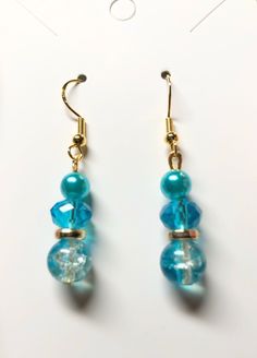 Caribbean blue dangle drops On gold plated hypoallergenic earring hooks French Hook Beaded Drop Earrings, Blue Dangle Hoop Earrings, Handmade Blue Dangle Pearl Earrings, Blue Drop Clip-on Earrings For Gift, Light Blue Dangle Earrings For Pierced Ears, Blue Dangle Pearl Earrings, Elegant Blue Hypoallergenic Hoop Earrings, Elegant Hypoallergenic Blue Hoop Earrings, Handmade Blue Pearl Drop Earrings