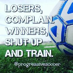 a soccer ball sitting on top of a lush green field with the words, losers, complan winners, shut up and train