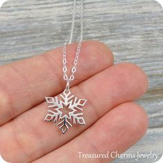 This Snowflake Necklace comes on a sterling silver chain that is available in different lengths. Please choose your desired length from the drop-down menu when placing the item in your shopping cart. { CHARM DETAILS }★ Material: .925 Sterling Silver★ Finish Color: Silver★ Measurements: 1/2" x 5/8"★ Dimensions: Double-sided{ SIMILAR ITEMS } More Christmas themed items available from my shop: https://www.etsy.com/shop/treasuredcharms/search?search_query=christmas{ GIFT OPTIONS}Gift boxes are avail Silver Snowflake Necklace For Holiday, Sterling Silver Necklaces For Winter Gifts, Silver Necklaces For Winter Holidays, Silver Jewelry As Winter Gift, Winter White Sterling Silver Necklaces, Silver Jewelry For Winter Gift, Sterling Silver Snowflake Jewelry For Winter, Sterling Silver Snowflake Jewelry, Nickel Free Sterling Silver Christmas Jewelry