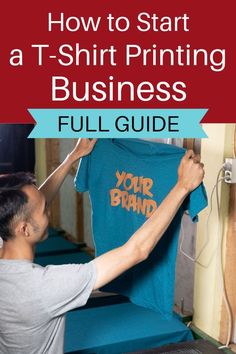 a man holding up a t - shirt with the words how to start a t - shirt printing business full guide