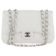 Chanel jumbo single Flap Bag features white diamond quilted leather. A leather-threaded polished silver chain-link shoulder strap, a rear patch pocket, and a matching silver classic CC turn-lock. This opens the bag to reveal an inner zipper pocket. Collection 12, copy of original receipt. Shoulder drop 13". Excellent exterior, minor wear in the interior. Hologram and dust cover. Luxury White Shoulder Bag With Cc Turnlock Closure, Classic White Bag With Cc Turnlock Closure, Classic White Double Flap Bag, Designer White Shoulder Bag With Cc Turnlock Closure, White Leather Shoulder Bag With Cc Turnlock Closure, White Double Flap Formal Bags, Elegant White Double Flap Shoulder Bag, Elegant White Shoulder Bag With Cc Turnlock Closure, Chic White Double Flap Shoulder Bag