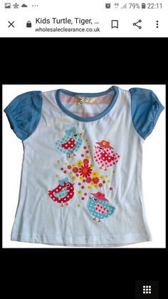 Children's animal crazy white with blue trim tee shirt. Depicting birds and flowers in pinks and blue. 100% cotton. Sizes available are 3 - 4 years x 1 5 - 6 years x 1 12 - 18 months x 1 18 - 23 months x 1 2 - 3 years x 1 6 - 12 months x 1 Please note the size required when ordering. Blue Cartoon Print Shirt For Spring, Playful Floral Print Cotton Tops, Playful White Floral Print Top, Blue Tops With Cartoon Print For Spring, Cute Printed Blue Tops, Playful Shirt For Spring Playtime, Playful Spring Shirt For Playtime, Printed Cotton T-shirt For Playtime, Spring Cotton Shirt For Playtime