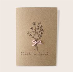 a card with a pink bow and flowers on it that says thank you bunches