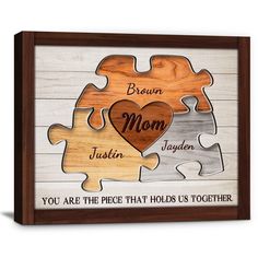 a wooden puzzle frame with the words, you are the piece that holds us together