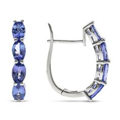 Gorgeous oval-cut tanzanite gemstones line these exquisite hoop earrings for her. The earrings are fashioned in sterling silver and secure with hinged backs. 45 Anniversary, Gold Layered Bracelets, Pearl Diamond Jewelry, Cross Jewelry Necklace, Fan Jewelry, Tanzanite Jewelry, Tanzanite Earrings, Shiny Objects, Diamond Wedding Rings Sets