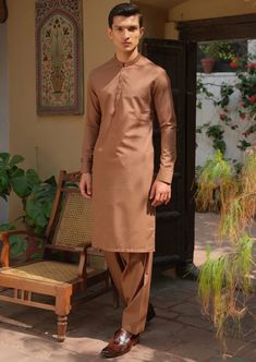 Details : Casual Suit For Men, With Textured Embroidery On Collar And Cuff Color: Rust Fabric : Blended Country of Origin : Pakistan Care Instruction : Should be washed in gentle cycle and hung to dry. Color may bleed so please be mindful of other items with it. Disclaimer : Actual sizes might be slightly different from the size chart. Classic Fitted Traditional Wear For Eid, Classic Semi-formal Sets For Eid, Classic Long Sleeve Festive Traditional Wear, Classic Unstitched Suit For Eid, Classic Unstitched Suit For Eid Semi-formal, Classic Unstitched Suit For Eid And Semi-formal Occasions, Classic Semi-formal Unstitched Suit For Eid, Classic Long Sleeve Traditional Wear For Eid, Classic Traditional Wear For Eid Festive