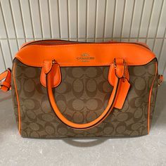 In Perfect Mint Condition No Flaws! Orange Rectangular Bags For Errands, Rectangular Orange Bags For Errands, Orange Double Handle Shoulder Bag For Errands, Orange Handheld Bag With Removable Pouch, Orange Shoulder Satchel For Errands, Orange Handheld Shoulder Bag For Travel, Orange Handheld Travel Bag, Handheld Orange Bag For Everyday, Orange Double Handle Bag For Errands