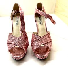 Size 8.5 Platform Pink Sparkle Heels. Never Worn.Perfect Barbie Shoes. 5 Inch Heels. These Glitter Platform Heels Are The Perfect Shoe To Have You Stand Out In The Crowd! With The Whole Shoe Covered In Shiny Glitter, You’ll Be Looking Glamorous All Night. These Include A Peep Toe, Ankle Strap, And A Chunky Platform Sole Completely Covered In Shiny Glitter. Pink Sequined Round Toe Heels, Pink Glitter High Heel Heels, Pink Glitter Heels For Night Out, Pink Glitter Heels For Formal Occasions, Formal Pink Glitter Heels, Glamorous High Heels With Glitter Print, Glamorous Glitter Print High Heels, Glamorous Heels With Glitter Print And Round Toe, Glamorous Glitter Print Heels With Round Toe