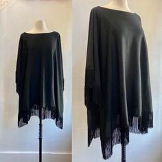 "Such a cool piece! Has  a wide neckline, fabric with a nice drape and is trimmed in fringe all around. As expected the  fringe provide loads of movement Great pretty much everything. Dress up or down.  A layer over a turtleneck, leggings and boots.  Fabric is a ponte knit so likely a wool rayon poly blend. Label is Lily Lynn \"Young Size\"   Original size 16. The measurement (all flat):   21\" wide with neckhole in the middle  / 25\" long (when folded). I'm always happy to provide more information - just send a message! ~~Condition Guide ~~ Mint: Perfect. Possibly never worn. Great: Little visible wear, lightly worn. Very Good: normal wear for the age.  Good: A few visible flaws but construction is sound and item is wearable." Fall Fringe Cape Poncho, Winter Fringe Cape Poncho, Long Sleeve Fringe Poncho, Oversized Fringe Cape Poncho, Black Oversized Long Sleeve Poncho, Black Fringe Poncho Shawl, Poncho Cape, Halter Maxi Dresses, Wool Plaid