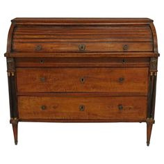 an old wooden chest with two drawers on one side and three small knobs on the other