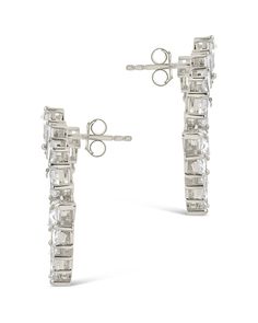 Experience the glamour of the red carpet with Shania Statement Studs! These celebrity-inspired earrings feature dazzling CZ stones sure to make you the star of any occasion. Make a statement and get ready for your close-up! Materials: 14K gold or rhodium plated brass, cubic zirconia Features: 1.1" stud, 3mm-6mm stones, Lead & Nickel free, post back White Gold Linear Earrings For Party, Glamorous Bridal Earrings With Prong Setting For Party, Classic Cubic Zirconia Chandelier Earrings For Party, Glamorous White Gold Crystal Earrings, Silver Crystal Earrings With Prong Setting For Party, Classic Party Diamond Earrings With Prong Setting, Classic Diamond Earrings With Prong Setting For Party, Glamorous Diamond Drop Earrings With Prong Setting, Glamorous Formal Earrings With Prong Setting