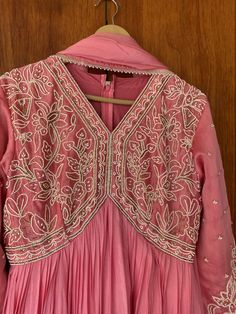 Heavy Hand embroidered Anarkali with banarasi dupatta / pure silk anarkali suit set / anarkali dupatta USA / chanderi dress with embroidered Kurta / Indian dresses/ voggish / pink anarkali gown dress         Looking for a perfect indian dress/anarkali/suit sets that are trendy, unique and easy to carry !! yess, You are at the right place. we carry such versatile pieces of anarkalis and suit sets that really let you stand out in any occassion !!      featuring this beautiful anarkali suit in onion  pink color with heavy pearl hand embroidered at the front body with full sleeves as shown !! A very classy, beautiful look makes you standout !! Ready to ship !! Can be done in any color and pattern !! Details :  - color : peach pink hand embroidered  - Dress : pure chanderi silk , chinnon silk a Pink Salwar Kameez With Cutdana For Navratri, Navratri Pink Salwar Kameez With Cutdana, Navratri Pink Cutdana Salwar Kameez, Pink Semi-stitched Anarkali Set For Festivals, Traditional Pink Salwar Kameez With Chikankari Embroidery, Pink Dola Silk Salwar Kameez With Straight Kurta, Unstitched Anarkali Set With Dori Work, Pink Dola Silk Kurta With Cutdana, Pink Salwar Kameez With Chikankari Embroidery