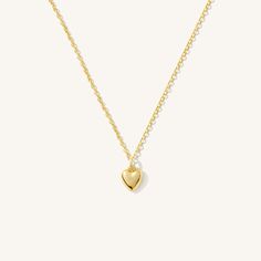 The Tiny Heart Necklace is the sweetest addition to any collection. Dainty yet durable, this necklace is ready for everyday wear, so you can feel the love on any occasion - date night, brunch with friends, or a coffee run by yourself! It also makes a precious gift for someone special to you. DETAILS Necklace length: 16" with 2" extender 14k gold filled -or- sterling silver necklace, jump ring, & findings 14k gold filled -or- sterling silver 8mm x 6.5mm heart charm Safe for sensitive skin & show Cheap Dainty Jewelry With Heart Beads, Cheap Gold Heart Charm Necklace, Affordable Gold Heart Charm Necklace, Cheap Dainty Charm Necklace For Best Friend, Affordable Gold Heart Pendant Necklace, Affordable Gold Minimalist Charm Necklaces, Cheap Dainty Heart Necklace For Everyday, Affordable Gold Chain Necklace With Heart Charm, Cheap Gold Jewelry With Heart Beads