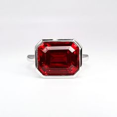 Emerald Cut Bezel Set Ruby Ring 14K Solid Gold , East West Emerald Shape Ruby Engagement Ring , July Birthstone Jewelry Gift for Her ,  still looking?: https://etsy.me/3Pzzwpx for more ruby rings click here: https://etsy.me/3Ak2j8e For ruby necklaces click here: https://etsy.me/3PJ3i7I The ring pictured is lab created ruby #7114  Available with other colored center stones  use drop down to make selection To revisit our store click here: https://etsy.me/3Pzzwpx -Approximate total carat weight:  3 Ruby Rings, July Birthstone Jewelry, Ruby Engagement Ring, Bezel Ring, Ruby Necklace, Ring Pictures, Blood Red, July Birthstone, Solitaire Rings