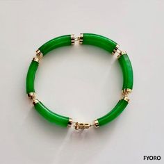 Our 'Fu Fuku Fortune Jade Bracelet' embodies radiance and stature, with hand carved jade lengths intertwined with 14K Gold; a unisex statement. Our top craftsman signs off the piece with a crafted symbol of fortune at the clasp. The Han symbol for fortune and luck evokes an unrivaled sense of positivity and happiness. Materials: 2.10g 14K Gold and 16.40g Jadeite (Approximately) Dimensions: 185 x 10 x 8 mm Gross Weight: 18.50 g Formal Yellow Gold Jade Bracelets, Formal Yellow Gold Jade Bracelet, Luxury Jade Bracelets For Formal Occasions, Luxury Formal Jade Bracelets, Elegant Yellow Gold Jade Bracelets, Elegant Yellow Gold Jade Bracelet, Luxury Gold Jade Bracelets, Jade Dragon, Purple Jade