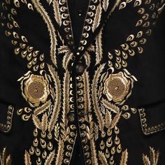 The Bespoke Black Blazer with Golden Hand-Embroidery is a masterpiece of elegance and opulence. Immerse yourself in the world of bespoke tailoring with this meticulously crafted garment.

 	Fabric: Velvet
 	Lining Fabric: Silk
 	Buttons: Brass
 	Pattern: Golden Hand Embroidery
 	Construction: Half Canvas
 	Jacket: Embroidery Shawl Lapel, Flap Pockets, Single Breasted Closure. Luxury Blazer, Embroidery Shawl, Jacket Embroidery, Blazer For Men, Canvas Jacket, Bespoke Tailoring, Black Luxury, Fabric Silk, African Attire