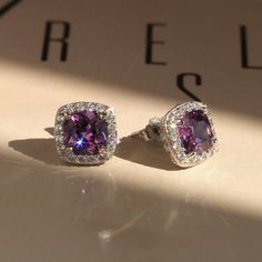 "✨💎 It gives you beautiful, attractive and outstanding jewelry experience ✨ * Everlasting Confidence * Wonderful Quality * Stay Shiny * Exquisite Fit Elevate Your Elegance: Amethyst Cushion Halo Stud Earrings Indulge in the allure of timeless sophistication with our Elegant Amethyst Cushion Halo Stud Earrings. Crafted with precision in solid 14K White Gold, these earrings are more than just jewelry; they're a statement of grace and refinement. Key Features: * Exquisite Amethyst Beauty: Adorning each earring is a magnificent 1 carat Cushion Cut Amethyst color  * Cubic Zirconia Stone, set within a radiant halo. Together, they create an impressive 2 carat total weight that will turn heads wherever you go. * Milgrain Filigree Finish: The back of these earrings features a delicate milgrain fil Elegant Purple Earrings For Pierced Ears, Amethyst Earrings Fine Jewelry For Formal Occasions, Formal Amethyst Gemstone Earrings, Cubic Zirconia Crystal Gemstone Earrings For Anniversary, Elegant Amethyst Earrings For Formal Occasions, Amethyst Gemstone Earrings For Formal Occasions, Purple Fine Jewelry Earrings For Formal Occasions, Anniversary Crystal Earrings With Cubic Zirconia Gemstones, Luxury Purple Earrings For Anniversary