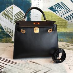 Description HRMS Kelly 28 Black Bag With Gold Toned Harware For Women, Handbags, Shoulder Bags 11in/28cm Rep 1:1 Size: 28 x 22 x 10 cm / 11 x 8.5 x 4.5 inches (Length x Height x Width) Hermès bags are considered the ultimate luxury item worldwide. Each piece is handcrafted with waitlists that can exceed a year or more. The streamlined and demure Kelly style is always in high demand, it is particularly lovely in this vibrant version with gold hardware. Epsom is textured with a wonderful grainy ap Hermes Kelly 28 Black, Kelly 28 Black, True Mirror, Hermes Kelly 28, Togo Leather, Stylish Handbags, Call Backs, Orange Leather, Hermes Bags