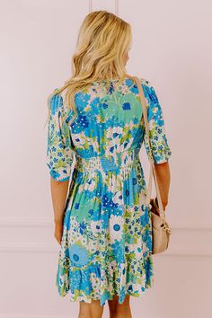 You will be the buzz of the town when you arrive in this pretty blue dress featuring lightweight breezy material patterned with a teal, green, and white floral print, a v-cut neckline with a front tie detail, loose half sleeves, and a relaxed skirt silhouette that falls into a straight mid-thigh length hemline! on products Measurements S : Bust 34", Hip 38", Length 36", Sleeve Length 12.5", Waist 28-30". M : Bust 36", Hip 40", Length 36", Sleeve Length 13", Waist 30-32". L : Bust 38", Hip 42", L Blue Floral V-neck Dress For Vacation, Blue Printed Mini Dress For Spring, Blue Summer Mini Dress For Garden Party, Summer Mini Dress For Garden Party In Blue, Blue Floral Sundress For Garden Party, Flowy Light Blue Mini Dress With Floral Print, Blue Floral Print Sundress, Flowy Blue Floral Mini Dress, Blue Printed Floral Dress For Garden Party