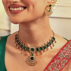 Description : This choker is a rich illustration of fine Indian partisanship. Showcasing opulent emerald green stones with an antique gold polish base, this simple yet striking choker is great for traditional events. Details & Specification : Materials used: Brass Alloy with Antique Gold Plating Weight - Choker-45.50 gm, Earrings-12.72 gm Length - Choker-17cm, Earrings-3.5cm Make it custom : Want to make it a custom Choker Set? Sure! Reach out to us at support@tarinika.com and we’ll be happy to Gold Choker Necklace Set Kameswari Jewellers, Emerald Jewellery Indian, Green Stone Jewellery Indian, Traditional Choker Indian Jewelry, Luxury 22k Gold Emerald Necklace Temple Style, Luxury Gold Kundan Emerald Necklace, Antique Emerald Necklace, Indian Emerald Jewellery, Antique Gold Pendant Designs