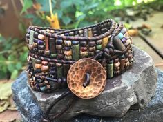 Artisan Wrap Bracelet With Round Beads For Festivals, Artisan Hand Wrapped Wrap Bracelet For Festivals, Artisan Hand-wrapped Wrap Bracelet For Festivals, Artisan Hand Wrapped Festival Wrap Bracelet, Handmade Artisan Brown Wrap Bracelet, Unique Brown Wrap Bracelet With Round Beads, Unique Beaded Brown Wrap Bracelet, Unique Brown Beaded Wrap Bracelet, Unique Hand Wrapped Brown Beaded Bracelets