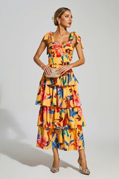 The Donne Floral Tiered Slip Dress exudes vintage French charm. With its flattering waistline and flowy tiers, this dress effortlessly enhances your silhouette. Its whimsical floral print adds a touch of femininity, making it perfect for beach vacations or a casual day out. Crafted from high-quality materials, this dress guarantees comfort and longevity.  Dress Length: Approx 117cm Materials: Polyester Gentle Dry Clean Only  The model is 5 ft 7 and wears size S  Color may vary due to lighting on images. The product images (without a model) are closest to the true color of the product.  Item runs true to size chart and is cut to suit our size chart. Please refer to our size chart for the best fit. Do not size up or down. Floral Print Midi Dress With Ruffled Straps For Brunch, Summer Tiered Printed Maxi Dress, Summer Floral Print Tiered Maxi Dress, Chic Tiered Floral Summer Dress, Summer Maxi Dress With Floral Print And Ruffled Straps, Floral Print Dress With Ruffled Straps For Vacation, Chic Tiered Floral Dress For Summer, Floral Print Dress With Ruffled Straps For Casual Wear, Summer Tiered Maxi Dress With Print