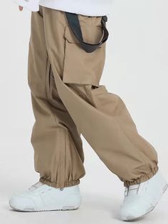 It's impossible to beat these jeans ski pants' bagginess and steezy colorways. Styled to make every fit look amazing, they’re guaranteed to be your favorite winter investment. Designed with 2 front zipper pockets, 2 back pockets, 2 cargo pockets, snow-repelling elastic cuffs and leg vents, there's no way you won’t enjoy your day in these baggy snow pants. Features Include: Waterproofing: 15K Waterproof / 10K Breathable Fabric: Polyester, OMINI-HEAT tech applied to save more heat. Fit: Baggy Insu Functional Baggy Pants For Outdoor Activities, Winter Cargo Pocket Parachute Pants For Outdoor Activities, Winter Outdoor Parachute Pants With Cargo Pockets, Hip Hop Cargo Style Bottoms For Outdoor Activities, Functional Baggy Pants For Outdoor, Functional Baggy Outdoor Pants, Khaki Hip Hop Bottoms For Outdoor, Baggy Urban Parachute Pants For Winter, Hip Hop Style Straight Leg Outdoor Bottoms