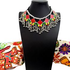 Summer is here! Celebrate with a colorful, playful, fun choker that compliments your wardrobe. Excellent quality, detailed ghungroo dangles, saturated vivid colors. Comfortable silky black cord tie, adjustable to the perfect fit for you. Shop chokers here: https://www.etsy.com/shop/boutiquebymaryam?section_id=23900841 Be sure to visit the rest of my shop here: https://www.etsy.com/shop/boutiquebymaryam Red Necklaces With Motifs For Gifts, Red Necklaces With Motifs For Festivals, Bollywood Choker Necklace For Festivals, Festival Bollywood Choker Necklace, Bollywood Festival Choker Necklace, Bollywood Style Festival Choker Necklace, Motif Necklaces For Festivals, Festive Multicolor Beaded Necklace With Latkans, Traditional Necklaces For Festivals