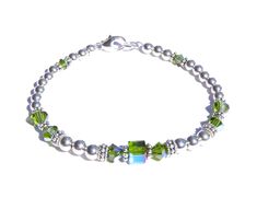 DARK Green Peridot (Olivine) August Birthstone Beaded Bracelets. Not Silver Plated - Not Silver Tone - Not Silver Finished Genuine Solid 925 Sterling Silver Accents on 57 Strand Woven Steel Cable. NO stretchy string or elastic. The sparkle of polished Sterling Silver, the dazzle of genuine Swarovski Crystals! You'll love this simple, classic Birthstone Bracelet - stack-able, well made, and trendy! Sterling Silver Birthstone Bracelet showcases Swarovski Crystals in sparkling simulated Birthstone May Birthstone Spacer Beads Jewelry Gift, Gift Jewelry With Spacer Beads For May Birthstone, Hypoallergenic Beaded Bracelets For Birthday, Hypoallergenic Beaded Bracelets For Birthdays, Adjustable Green Beaded Bracelets As Birthday Gift, Adjustable Green Beaded Bracelet For Birthday Gift, Adjustable Green Beaded Bracelet For Birthday, Green Adjustable Beaded Bracelets For Birthday Gift, Nickel-free Green Beaded Bracelets As A Gift