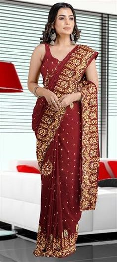 Red and Maroon color Saree in Georgette fabric with Stone work Red Saree With Dori Work For Reception, Red Floor-length Saree With Resham Embroidery, Red Floor-length Saree With Cutdana, Red Floor-length Cutdana Saree, Red Georgette Floor-length Saree, Red Traditional Wear With Pallu For Reception, Red Saree For Diwali Reception, Elegant Red Embroidered Fabric For Wedding, Red Saree With Intricate Embroidery For Festivals