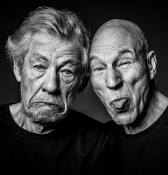 two older men are posing for a black and white photo with their faces close together