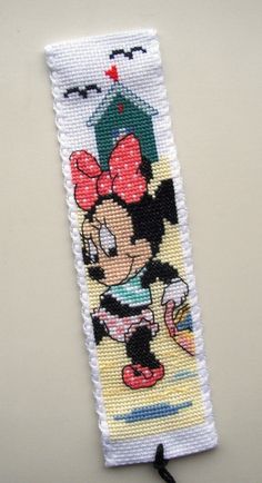 a cross stitch bookmark with minnie mouse on it