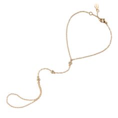 This hand chain features cubic zirconia stones in a bezel setting to add sparkle. Wear alone or pair with the matching ring for a beautiful and delicate look. Thick layer of 14K Gold over .925 Sterling Silver Cubic Zirconia pave crystals, 3mm Hypoallergenic, lead and nickel free Purchase the Handchain on its own or as a set with the Pave ring Wrist Length:6-6.75in(15-17cm), 7-7.5in(18-19cm) Crystal Length 2.5in(6.3cm) Handcrafted in NYC #B301 Hand Chain Bracelet, Matching Ring, Gold Hand, Crystal Chain, Hand Chain, Pave Ring, Matching Rings, Dainty Bracelets, Gold Bracelet Chain