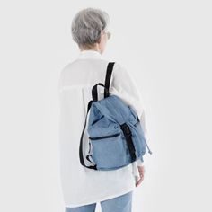 A backpack for all seasons and all phases of life—for school, for work, for life in general. Two exterior zip pockets keep things easily accessible, and an interior sleeve keeps your laptop secure. ● 13" interior laptop sleeve ● Expandable drawstring and buckle closure ● Two exterior and one interior zippered pockets ● Measures 14 ½" × 14" × 6 ● 30" adjustable logo straps ● Recycled heavyweight nylon exterior, recycled ripstop nylon interior ● Machine washable Trendy Travel Backpack With Zipper Pocket, Versatile Everyday Gym Bag With Pockets, Casual Canvas Backpack With Zipper Pocket, Casual Travel Backpack With Zipper Closure, Functional Gym Bag With Pockets For Everyday Use, Functional Everyday Gym Bag With Pockets, Casual Canvas Travel Bag With Zipper Pocket, Trendy Leather Backpack For Everyday And Back To School, Travel Canvas Shoulder Bag For Back To School