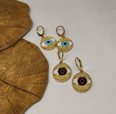 hoop earringsgold hoop earringsdangle earringshuggie hoop earringsclip on earringsgold evil eyeevil eye earringsgold earringsdrop earringsgift for hervintage earringsstatement earringseye earringsGold evil eye hoop earringsThis cute earrings are made from steell and they are 24k gold plated and handpainted.You can choose between 4 different clasps (the numbers 1 and 2 are for non pierced ears)They are very light and comfortable!Plus they are anti allergic/ nickel free ❤Evil eye meaningThe evil e Trendy Handmade Gold Plated Jewelry, Yellow Gold Evil Eye Earrings For Gift, Pierced Small Hoop Jewelry As A Gift, Pierced Small Hoop Earrings As A Gift, Small Hoop Pierced Jewelry As A Gift, Eye-catching Dangle Jewelry For Gifts, Small Hoop Earrings Gift, Metal Evil Eye Jewelry, Gift Small Hoop Clip-on Earrings Tarnish Resistant