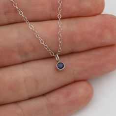 Very classy, simple, and dainty. This handcrafted gold pendant has a natural Sapphire stone and comes on your choice of a 16 inch or an 18 inch 14kw gold chain. It can also be paired with other pendants! Mix and match to create your own personalized necklace or mother necklace! Gold is 14k white with a rhodium plating. Stone measures 3mm in diameter. Birthstone for September. All Laine Benthall jewelry comes with a lifetime warranty. This pendant can also be purchased without the chain, just go Nickel Free Round Stone Minimalist Jewelry, Minimalist Nickel-free Jewelry With Round Stone, 14k Gold Silver Round Pendant Birthstone Necklace, Sterling Silver Solitaire Necklace With Round Pendant For Everyday, Minimalist Sapphire Birthstone Necklace For Gift, Minimalist White Gold Birthstone Necklace With Delicate Chain, Simple White Gold Jewelry With Polished Finish, Simple Polished White Gold Jewelry, Delicate Sterling Silver Birthstone Pendant Necklace