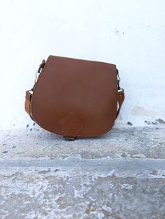 New Brown Saddle bag with adjustable cross body strap. Custom made bag in plenty of colors with adjustable strap. This is the perfect IT bag for this season all across runways and celebrities. Dimensions: SMALL: 20*22 cm MEDIUM: 22*28 cm LARGE: 25*28*10 cm Strap: 125 cm All Bags are made to order. If you like this bag, please see our full collection in the below link: https://www.etsy.com/shop/madammeshushu?section_id=17490770&ref=shopsection_leftnav_3 More on who we are Welcome to my store Brown Leather Shoulder Bag With Adjustable Handle, Brown Crossbody Saddle Bag With Detachable Strap, Leather Crossbody Hobo Bag With Mobile Phone Bag, Crossbody Saddle Bag With Removable Pouch, Daily Use Crossbody Saddle Bag With Detachable Strap, Brown Crossbody Shoulder Bag With Adjustable Handle, Brown Crossbody Satchel With Adjustable Handle, Daily Use Tote Saddle Bag With Adjustable Strap, Daily Use Satchel Saddle Bag With Adjustable Handle