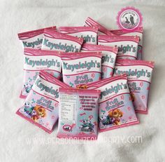 five packs of toothpaste for girls on a white sheet with pink trimming