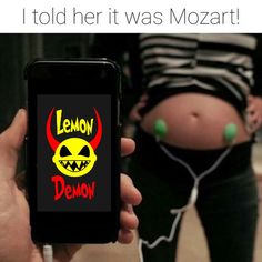 a person holding up a cell phone with the caption, i told her it was mozzart