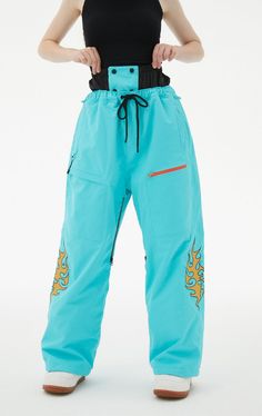 Seal out snow and wet weather with the RandomPow Ladies Snow Trousers. These blue ski pants fit close to the skin and have a soft fleece lining for extra comfort on the slopes. Pants Features: Waterproofing: 20K Waterproof / 15K Breathable Fabric: 228T Nylon Taslon (Blue-Orange) & 150D Twill Polyester (Gray-Pink) Lining: Fleece + 100% Nylon Panel (for warmth) DWR (Durable Water Repellent) with non-fluorinated strong water repellency Seams: Critically taped seams Pockets: Multiple zipper function Full Length Snowboarding Bottoms For Ski Season, Casual Snowboarding Pants For Ski Season, Waterproof Skiing Bottoms For Ski Season, Sporty Waterproof Bottoms For Ski Season, Sporty Snowboarding Bottoms For Ski Season, Waterproof Sporty Bottoms For Ski Season, Full Length Pants For Snowboarding Ski Season, Sporty Skiing Bottoms For Ski Season, Full Length Snowboarding Pants For Ski Season