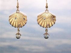 These are handcrafted gold color shell dangle pierced earrings made from novelty charms.  Each earring hangs about 1-3/4" long,  The gold color is not as dark as it comes through the pictures and they have sparkle gems that don't show well in the pictures.  The wire used is a gold color.   At this time I have to ship ONLY to U.S. addresses. Pierced Earrings, The Wire, Jewelry Earrings Dangle, Gold Color, Dangle Drop Earrings, Dangle Earrings, Shells, Jewelry Earrings, Charms